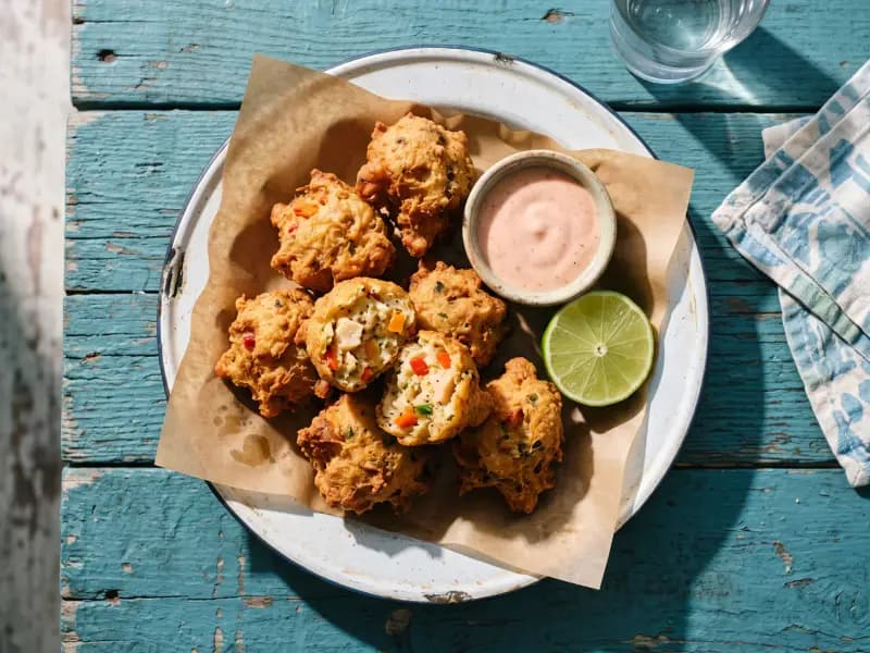Conch Fritters — shot from directly overhead: chopped conch in a loose batter with sweet pepper and scotch bonnet