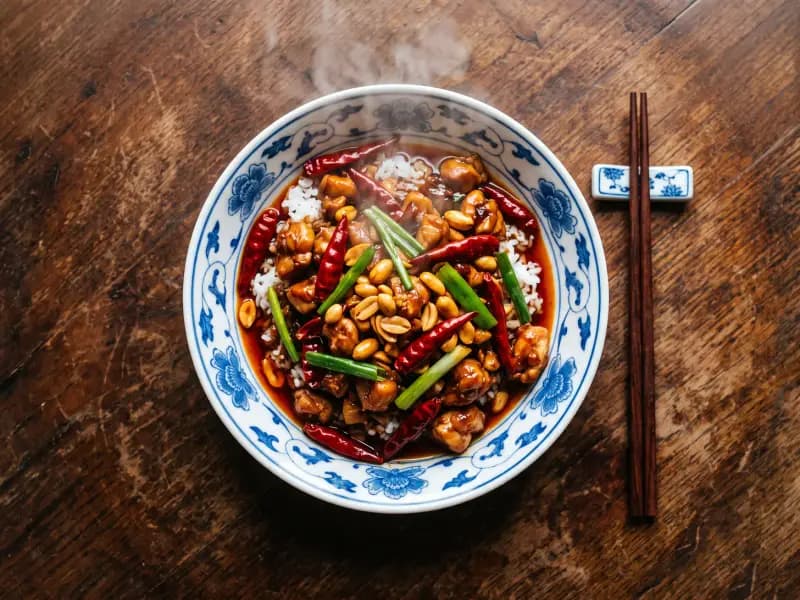 Kung Pao Chicken — shot from directly overhead: diced chicken stir-fried fast with dried chillies and peanuts in a sauce that is sour