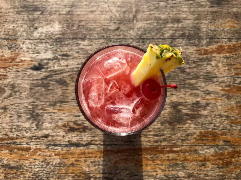 Singapore Sling — shot from directly overhead, the table surface filling the frame